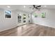 Bright bonus room with wood floors, a ceiling fan, and views of the backyard at 957 Sharon Se Cir, Smyrna, GA 30080