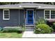 Close up of the front door and walkway featuring landscaping and a blue painted entry door at 957 Sharon Se Cir, Smyrna, GA 30080