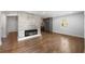 Open-concept living room with hardwood floors and modern accents, leading to kitchen at 957 Sharon Se Cir, Smyrna, GA 30080