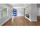 Well-lit living room showcasing hardwood floors, a modern fireplace and bright blue front door at 957 Sharon Se Cir, Smyrna, GA 30080