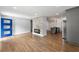 Bright living room with a modern fireplace, blue door and an open view to the kitchen at 957 Sharon Se Cir, Smyrna, GA 30080
