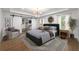 Spacious main bedroom with modern lighting, closet, and hardwood floors at 957 Sharon Se Cir, Smyrna, GA 30080