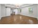 Spacious main bedroom with closet, modern lighting, and hardwood floors at 957 Sharon Se Cir, Smyrna, GA 30080
