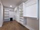 Large walk-in closet with custom shelving and ample storage space at 957 Sharon Se Cir, Smyrna, GA 30080