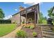 Spacious backyard featuring a deck, patio, and lush landscaping at 6245 Hampton Golf Club Dr, Cumming, GA 30041