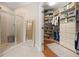 Bathroom featuring a glass shower, walk in closet and tile flooring at 6245 Hampton Golf Club Dr, Cumming, GA 30041