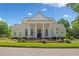 Elegant community clubhouse featuring white columns, and professional landscaping at 6245 Hampton Golf Club Dr, Cumming, GA 30041