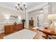 Entryway featuring hardwood floors and decorative lighting at 6245 Hampton Golf Club Dr, Cumming, GA 30041