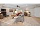 Open living room featuring hardwood-style flooring, and a comfortable seating arrangement at 6245 Hampton Golf Club Dr, Cumming, GA 30041