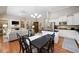 Open-concept living room featuring hardwood floors and modern decor at 6245 Hampton Golf Club Dr, Cumming, GA 30041