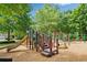 Community playground with slides, climbing structures, and swings for outdoor fun at 6245 Hampton Golf Club Dr, Cumming, GA 30041