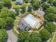 Aerial view of a community pool surrounded by trees and lounge chairs at 6245 Hampton Golf Club Dr, Cumming, GA 30041