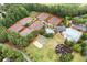 Great aerial view of the community amenities including the pool, tennis courts, playground, and green space at 120 Bent Creek Dr, Woodstock, GA 30189
