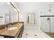 Bathroom with double vanity, marble floors, and walk-in glass shower at 120 Bent Creek Dr, Woodstock, GA 30189