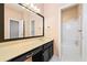 Bright bathroom featuring a sleek vanity with a large mirror and a combined shower and tub at 120 Bent Creek Dr, Woodstock, GA 30189