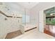 Bathroom with glass-enclosed shower and soaking tub, accessible from the main bedroom at 120 Bent Creek Dr, Woodstock, GA 30189
