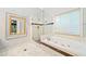 Bathroom with glass-enclosed shower and soaking tub at 120 Bent Creek Dr, Woodstock, GA 30189