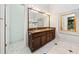 Bathroom with double vanity, ample lighting, and marble floors at 120 Bent Creek Dr, Woodstock, GA 30189