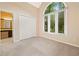 Bedroom with neutral carpet and access to the bathroom at 120 Bent Creek Dr, Woodstock, GA 30189