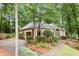 Exterior side view of home showing the attached garage and landscaping at 120 Bent Creek Dr, Woodstock, GA 30189