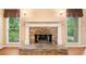 Stone fireplace with white mantle and hardwood floors at 120 Bent Creek Dr, Woodstock, GA 30189