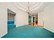 Hallway showcasing chandelier, blue carpet and vintage wallpaper and open access to the living areas at 120 Bent Creek Dr, Woodstock, GA 30189