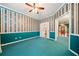 Living room showcasing unique wallpaper, blue carpet and access to front entry at 120 Bent Creek Dr, Woodstock, GA 30189