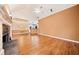 Spacious living room featuring a stone fireplace, hardwood flooring, and open access to the kitchen at 120 Bent Creek Dr, Woodstock, GA 30189