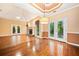 Open-concept living room with vaulted ceilings, fireplace, and French doors at 120 Bent Creek Dr, Woodstock, GA 30189