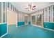 Cozy living room with large windows, vintage wallpaper and plush blue carpet at 120 Bent Creek Dr, Woodstock, GA 30189