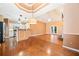 Open living space with hardwood floors connecting the kitchen and living room at 120 Bent Creek Dr, Woodstock, GA 30189