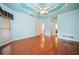 Spacious main bedroom with tray ceiling, ceiling fan, and large windows at 120 Bent Creek Dr, Woodstock, GA 30189