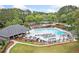 Aerial view of the community pool and deck area with many chairs for relaxing at 120 Bent Creek Dr, Woodstock, GA 30189