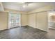 Finished basement area with tile flooring, double doors, and an open doorway to a bathroom at 2059 Howell Mill Nw Rd, Atlanta, GA 30318
