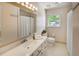 Well-maintained bathroom featuring a single sink vanity, and a shower-tub combination at 2059 Howell Mill Nw Rd, Atlanta, GA 30318