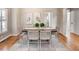 Dining room with hardwood floors, a modern table setting, and abundant natural light at 2059 Howell Mill Nw Rd, Atlanta, GA 30318