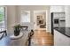 Bright kitchen with stainless steel appliances, a granite countertop, and an adjacent dining nook at 2059 Howell Mill Nw Rd, Atlanta, GA 30318