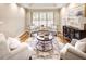 Cozy living room with hardwood floors, tray ceilings, designer furniture, and plantation shutters at 2059 Howell Mill Nw Rd, Atlanta, GA 30318
