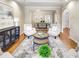 Open living area featuring hardwood floors, designer furniture, and seamless access to the dining room at 2059 Howell Mill Nw Rd, Atlanta, GA 30318