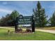 Entrance sign for Bitsy Grant Tennis Center in Atlanta with landscaping and green grass at 2059 Howell Mill Nw Rd, Atlanta, GA 30318