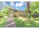 Backyard featuring a brick house, a wooden deck and mature trees for outdoor activities and relaxation at 2702 Rollingwood Se Ln, Atlanta, GA 30316