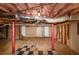 Spacious unfinished basement featuring red support columns, ideal for storage or future customization at 2702 Rollingwood Se Ln, Atlanta, GA 30316