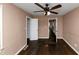 This bedroom showcases an open door and hardwood flooring at 2702 Rollingwood Se Ln, Atlanta, GA 30316