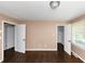 A bright bedroom showcases hardwood floors, two closets and a window offering natural light at 2702 Rollingwood Se Ln, Atlanta, GA 30316