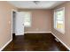 A cozy bedroom features hardwood floors and a window for natural light, perfect for relaxation at 2702 Rollingwood Se Ln, Atlanta, GA 30316