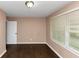 This bedroom features hard wood floors and a window with white blinds at 2702 Rollingwood Se Ln, Atlanta, GA 30316
