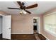 Bedroom showcasing a ceiling fan and doorway to an ensuite bathroom at 2702 Rollingwood Se Ln, Atlanta, GA 30316