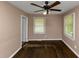 This bedroom has hardwood floors and two windows with blinds at 2702 Rollingwood Se Ln, Atlanta, GA 30316