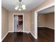 Dining room showcasing hardwood floors and an adjacent kitchen at 2702 Rollingwood Se Ln, Atlanta, GA 30316
