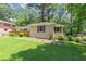 Ranch-style home with a well-maintained lawn and mature trees providing shade and curb appeal at 2702 Rollingwood Se Ln, Atlanta, GA 30316